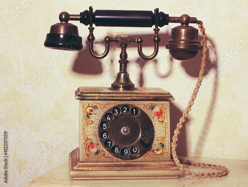 Vintage old telephone with old background.Vintage background photo