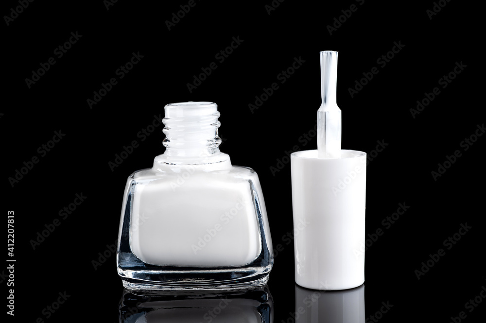white nail polish on a black background close-up. copy space white nail polish on a black background close-up. copy space