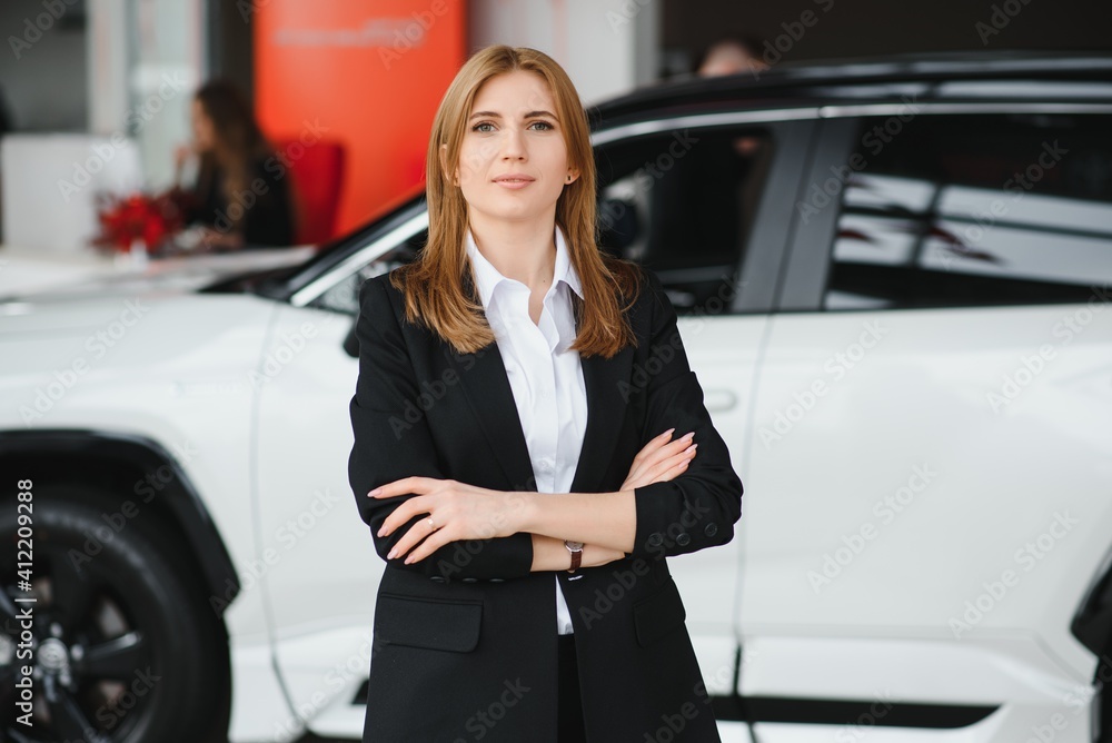 Salesperson selling cars at car dealership Salesperson selling cars at car dealership