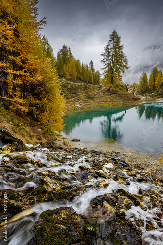 Fototapeta Naklejka Na Ścianę i Meble -  autumn mood over alpine lake in Valais