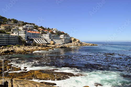 Canvastavla Rocks, the sea and buildings on the slope of the hill in Bantry Bay, Cape Town, South Africa