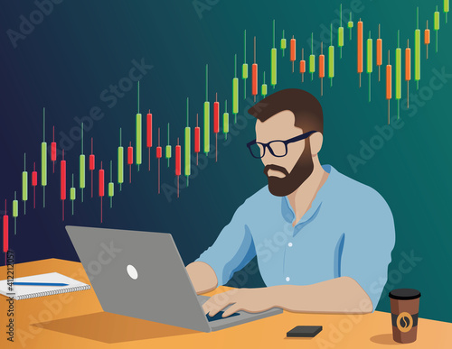 Young trader working focused on a laptop. Personal finance investment and stock trading. Trading graphics on background.