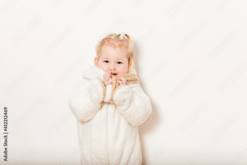 half-year-old European baby girl in fluffy white bunny costume on white background half-year-old European baby girl in fluffy white bunny costume on white background
