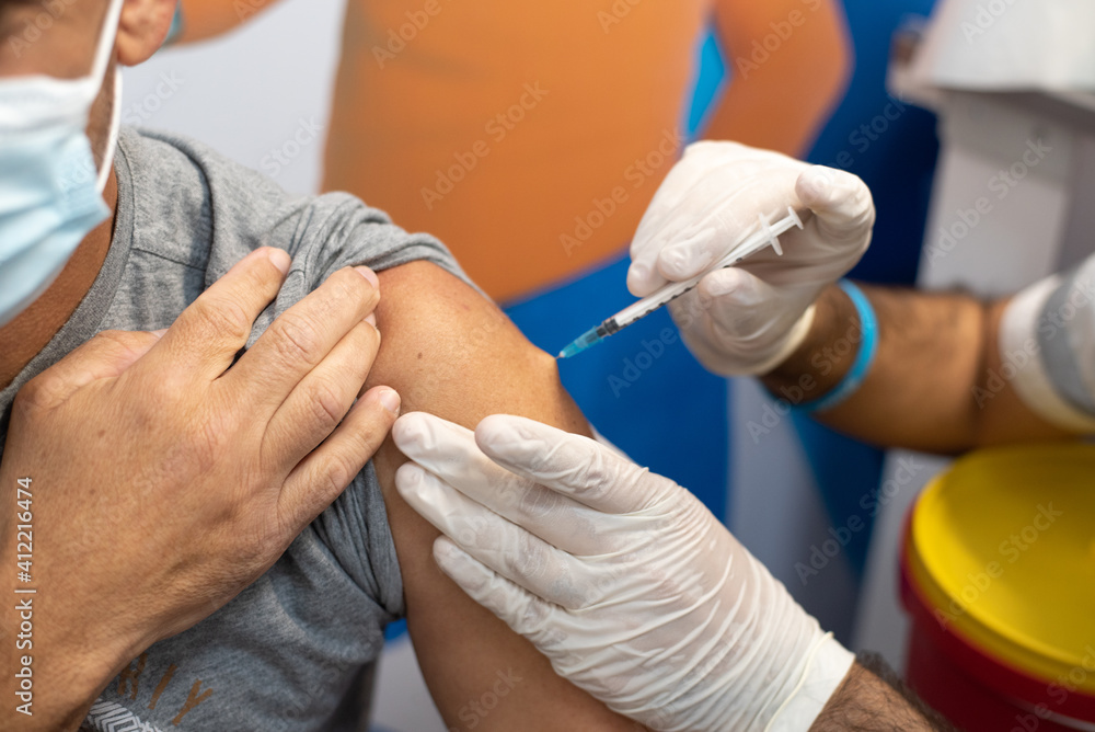 Doctor gives an elderly woman coronavirus vaccine. Elderly people are injected all over the world. Injectable liquid for a safe life Doctor gives an elderly woman coronavirus vaccine. Elderly people are injected all over the world. Injectable liquid for a safe life