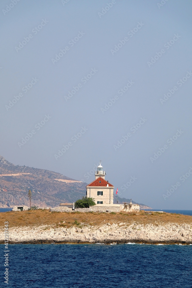 Picturesque lighthouse on small island near Hvar, Croatia.