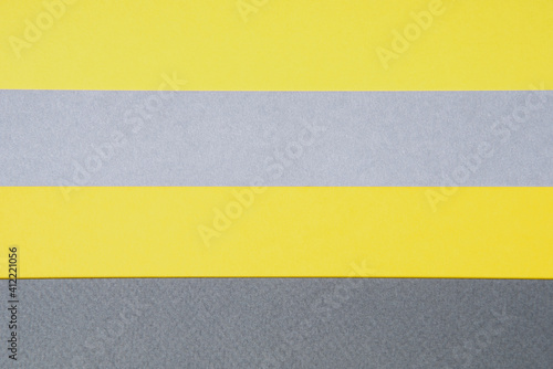 Gray and yellow paper top view. Template with geometric shapes for design in trendy colors with place for text