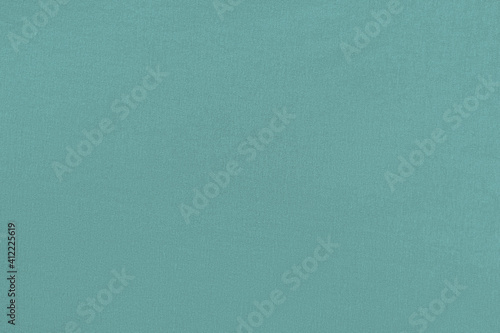 Turquoise homogeneous background with a textured surface