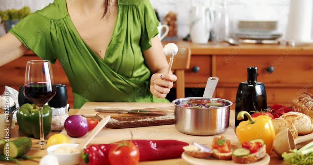 Beautiful woman preparing delicious spring food from fresh vegetables Beautiful woman preparing delicious spring food from fresh vegetables