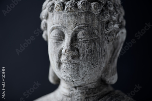 Meditating Buddha Statue on dark background. Close up. © Eugeniusz Dudziński