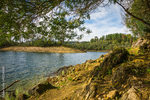 Riverbank with beautiful vegetation in Castelo de Bode water dam, Portugal © WildGlass Photograph