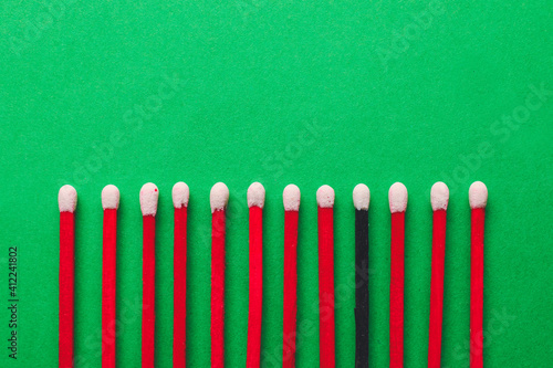 Matches on color background. Concept of uniqueness