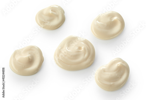Decorative blobs of swirled mayonnaise