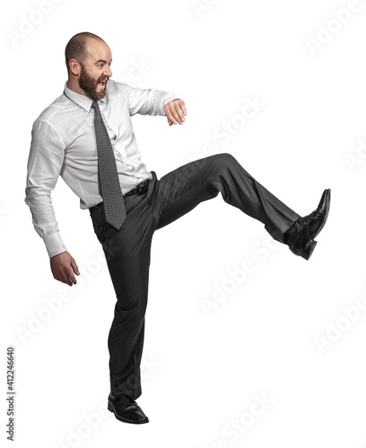 caucasian businessman in kicking position.