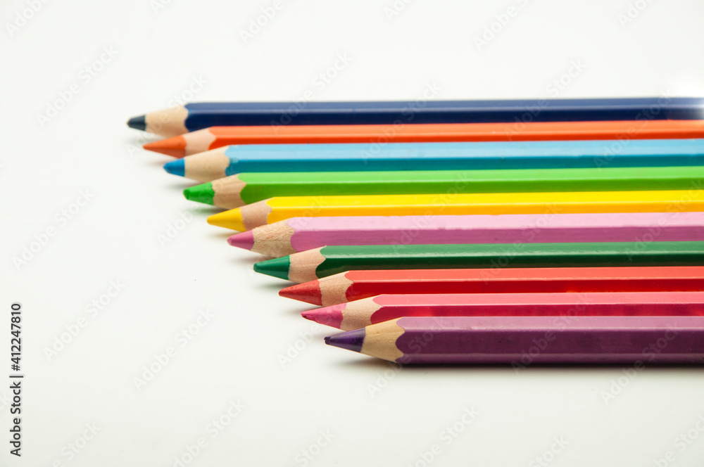 colored pencils on a white background. education concept. illustration of training. colored pencils on a white background. education concept. illustration of training.