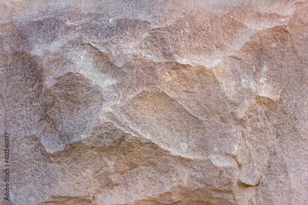 The texture of the stone.Stone brown background.