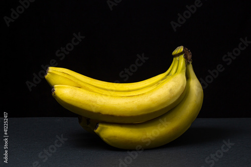 Bananas on a black background. Healthy food. Banana bunch