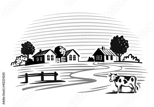 cow stands in a village next to houses