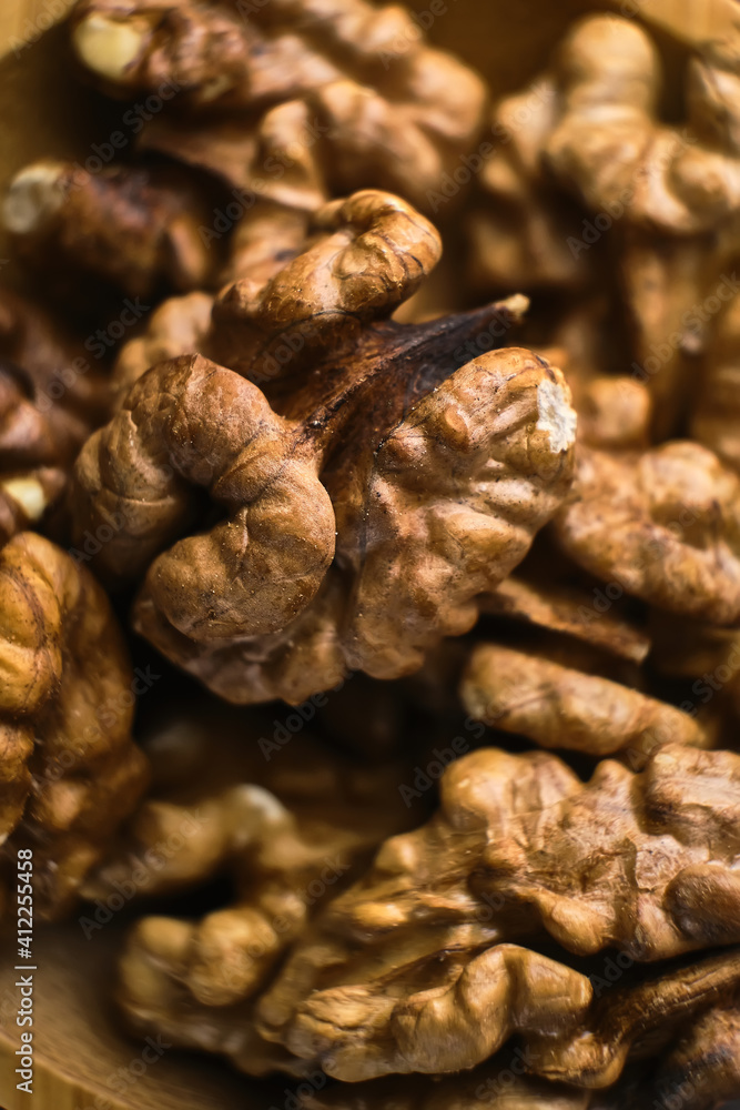 Background of fresh walnuts. Selective focus, macro Background of fresh walnuts. Selective focus, macro