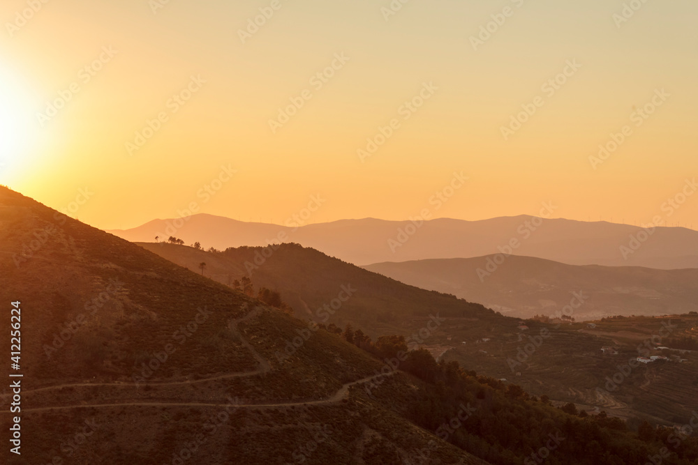 Panoramic view of hills at sunset