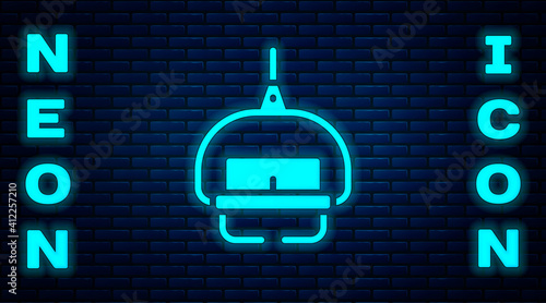 Glowing neon Ski lift icon isolated on brick wall background. Vector.