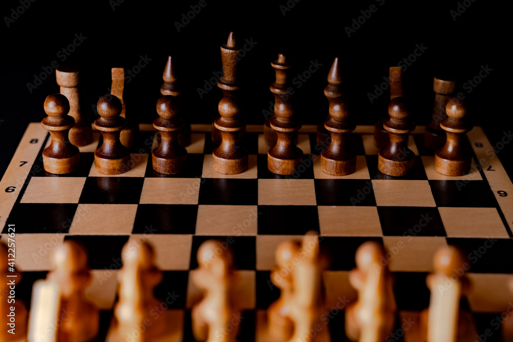 White and black pieces on chess board. Chess board set during the game White and black pieces on chess board. Chess board set during the game