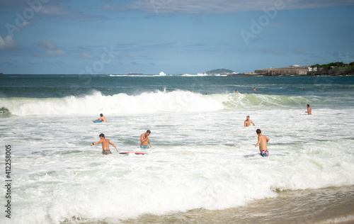  Citizens swim  on the beach of Copacabana © aleks