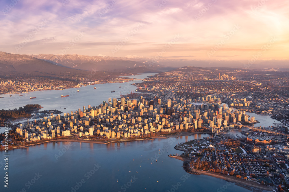 Aerial view of Stanley Park and Downtown Vancouver, BC, Canada. Dramatic Colorful Sunset Sky Art Render.