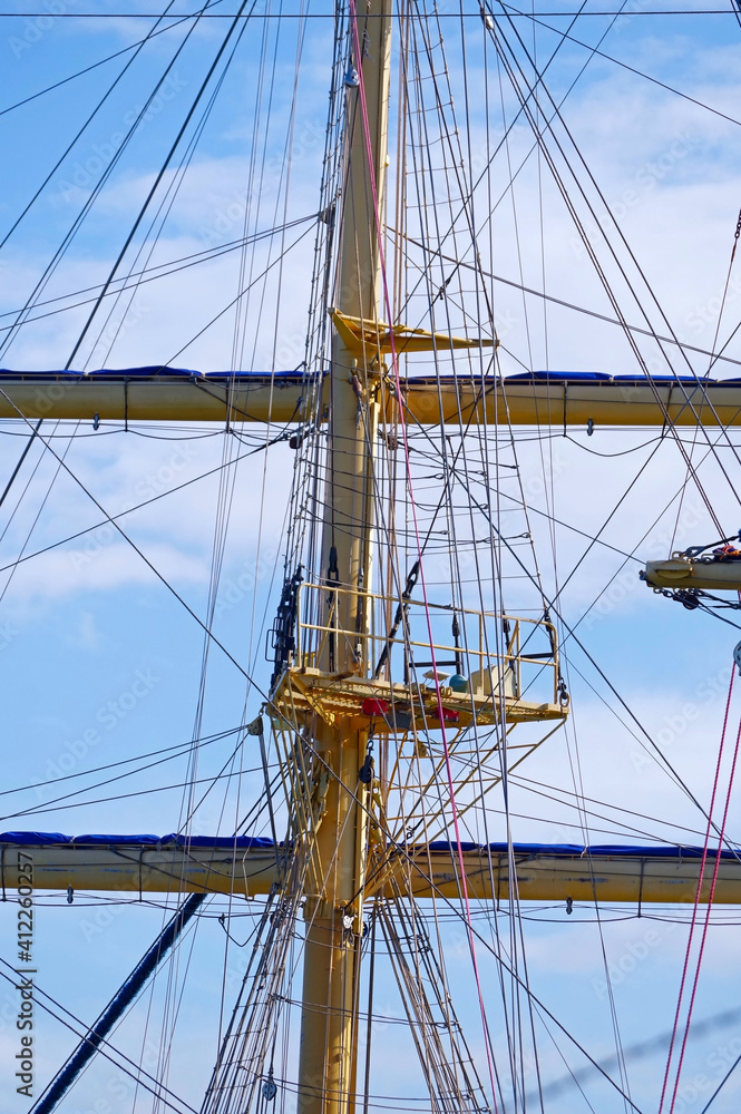 Masts and rigging of a sailing ship against sky Masts and rigging of a sailing ship against sky