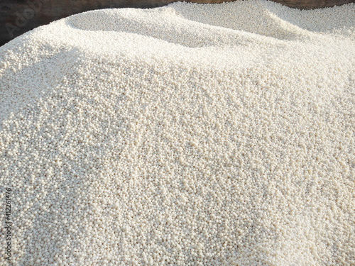 Chemical, granulated mineral fertilizer. White fertiliser background.