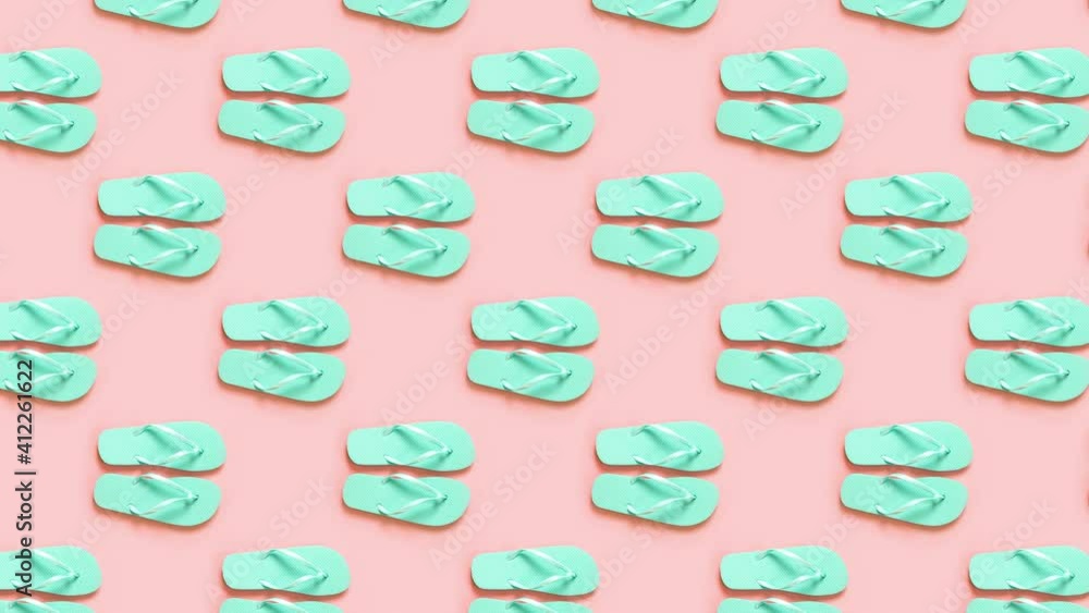 Green flip flops over pink background motion to the right. Summer concept. 4k video. Green flip flops over pink background motion to the right. Summer concept. 4k video.