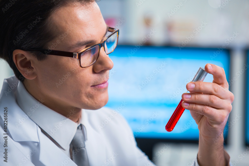 Professional scientist is working on a vaccine in a modern scientific research laboratory. Genetic engineer workplace. Future technology and science. Professional scientist is working on a vaccine in a modern scientific research laboratory. Genetic engineer workplace. Future technology and science.