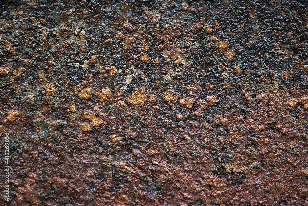 It's an old, rusty, dark-colored metal surface. Abstract background with texture on the corrosion of metals. Backdrop for the design It's an old, rusty, dark-colored metal surface. Abstract background with texture on the corrosion of metals. Backdrop for the design