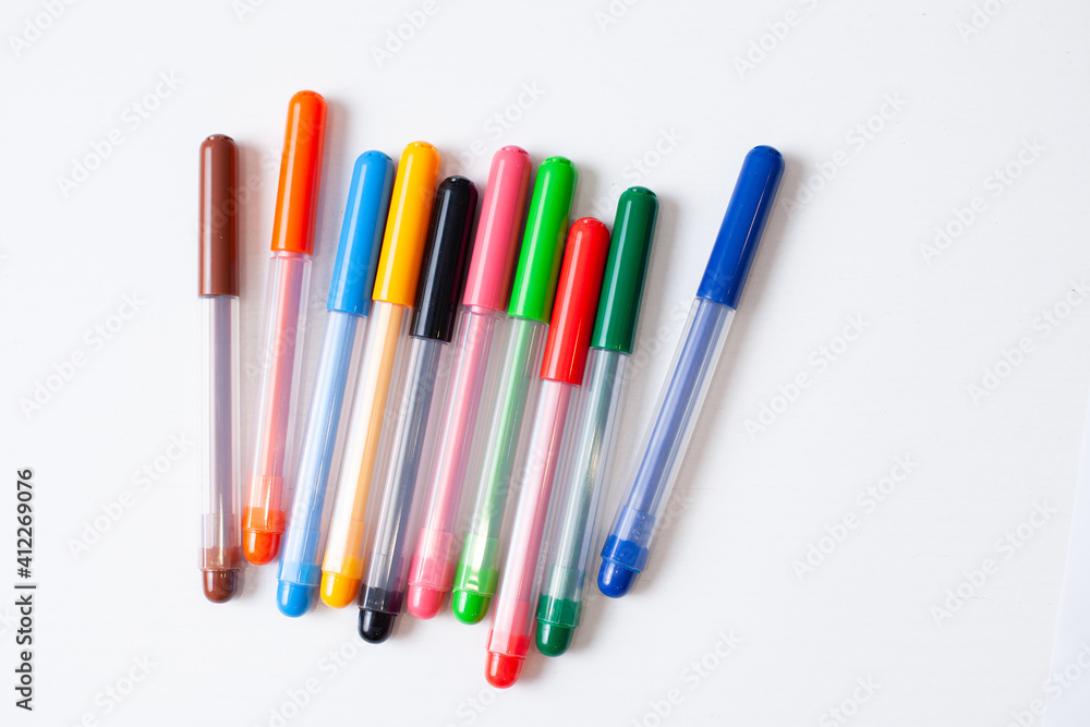 Fototapeta premium colored markers markers on a white background bright rainbow creativity drawing general plan child development drawing