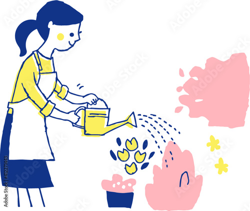 花に水やりをする女性