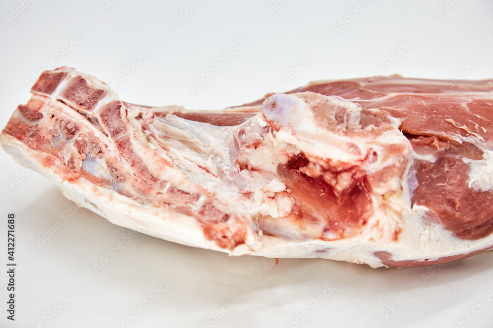 A piece of fresh raw meat pulp on a white background, isolated. The concept of cooking dishes from fresh meat, beef, bones, the best restaurant, delicious cuisine