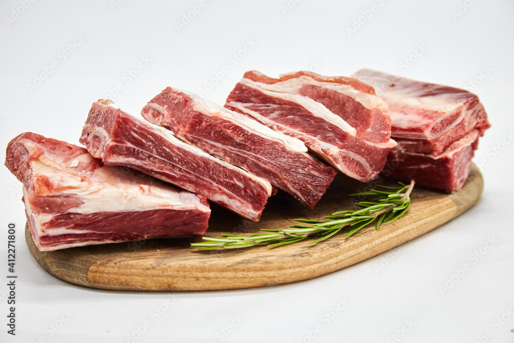 A piece of fresh raw meat pulp on a white background, isolated. The concept of cooking dishes from fresh meat, beef, bones, the best restaurant, delicious cuisine