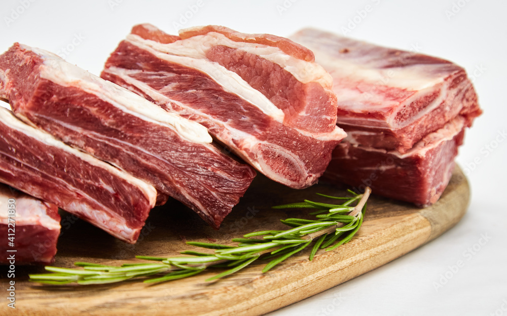 A piece of fresh raw meat pulp on a white background, isolated. The concept of cooking dishes from fresh meat, beef, bones, the best restaurant, delicious cuisine