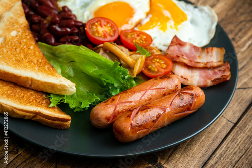 Rustical breakfast eggs, sausages, vegetables