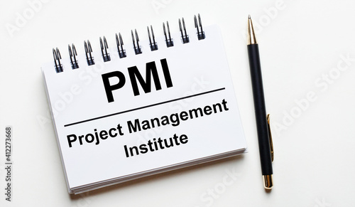 Wallpaper Mural On a light background, a white notebook with the words PMI Project Management Institute and a pen. Torontodigital.ca