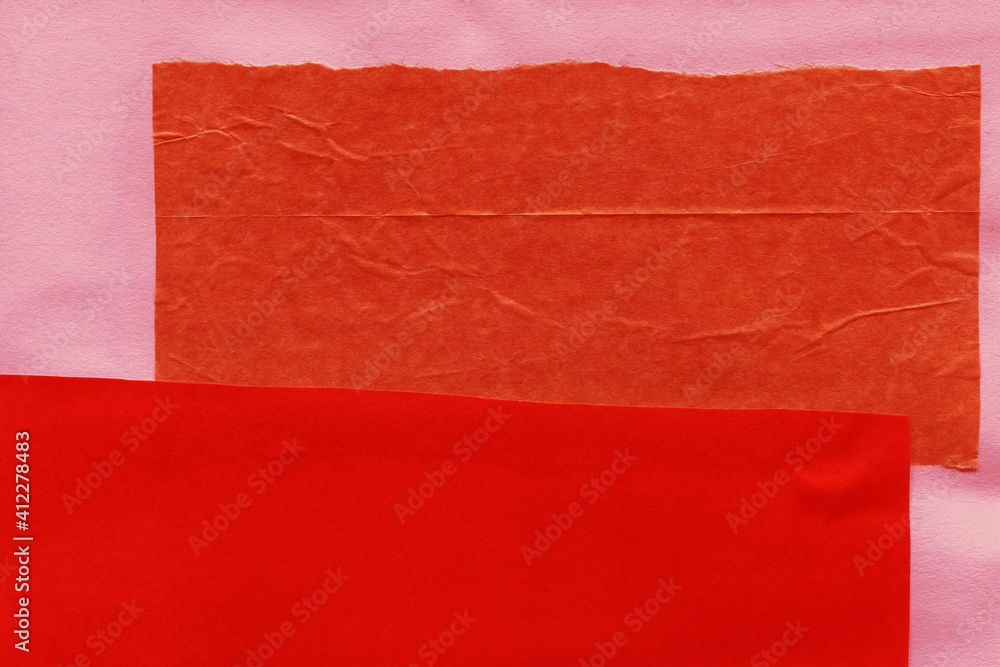 Obraz premium Red and brown torn paper collage close-up. Texture made from various paper and cardboard parts. Damaged old paper background. Vintage blank wallpaper. Material design backdrop.