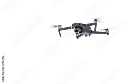 Flying drone quadcopter with a camera isolated on white background