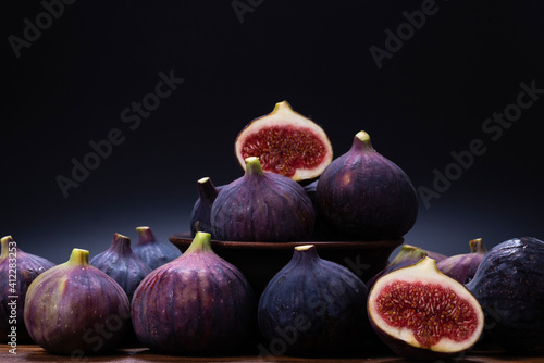 Tasty figs on a black background. Top view.