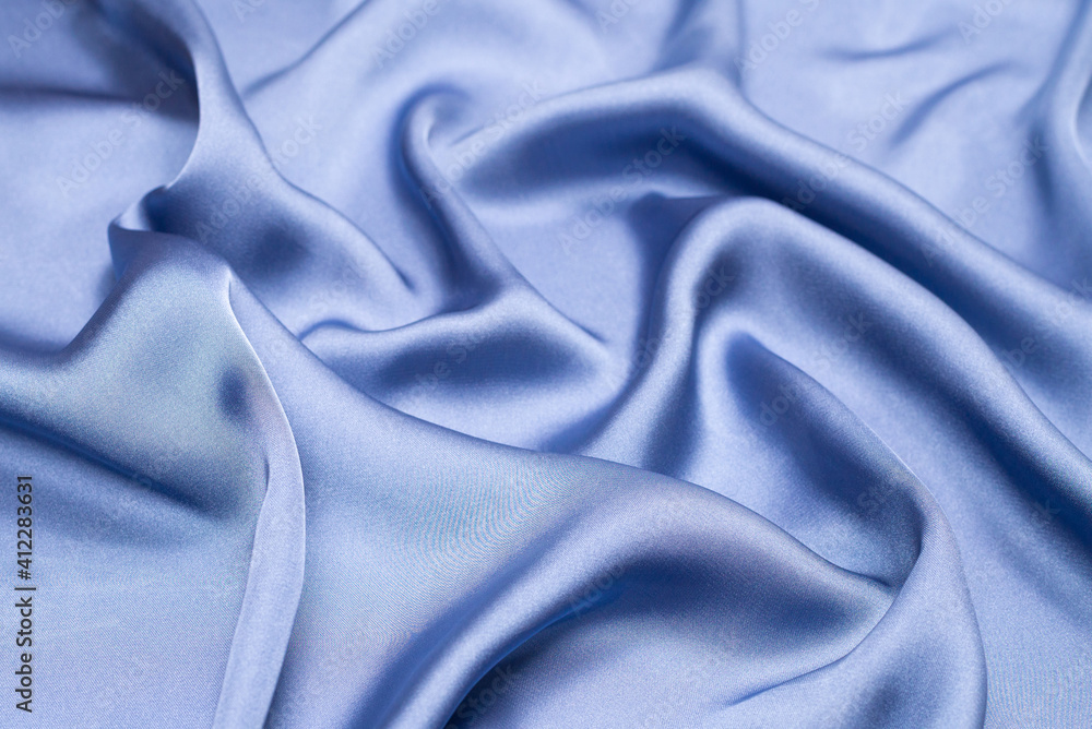 Obraz premium Blue silk or satin luxury fabric texture. Top view.