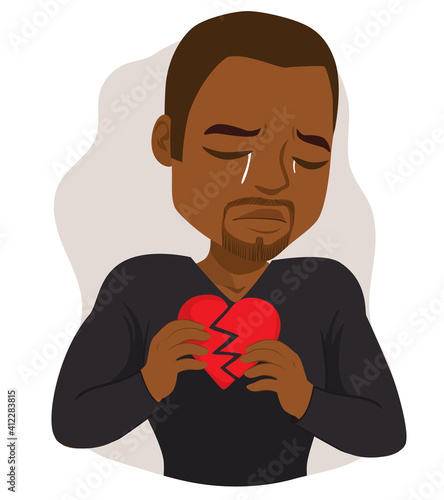Black man crying sad holding broken heart feeling hurt