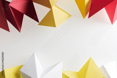 Composition of geometric shapes made colorful paper  white background