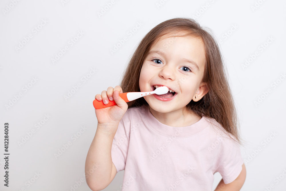 A girl of European appearance with light brown hair and blue eyes is brushing her teeth. Hygiene. Dental care. Dentistry. Health. Smile, joy, emotions. Portrait on a white background in neutral color
A girl of European appearance with light brown hair and blue eyes is brushing her teeth. Hygiene. Dental care. Dentistry. Health. Smile, joy, emotions. Portrait on a white background in neutral color