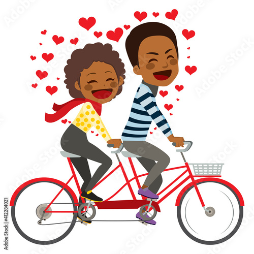 Cute young black couple on Valentine day riding on tandem bicycle celebrating love together