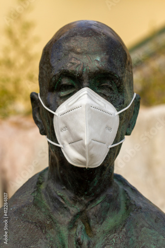 N95 Mask fitted on a statue  photo