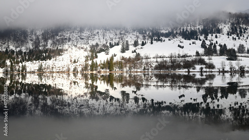 Morning fog on lake Bohinj, Slovenia