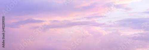 Beautiful sky with soft sunlight in pink and purple. Panorama of the beautiful sky.
